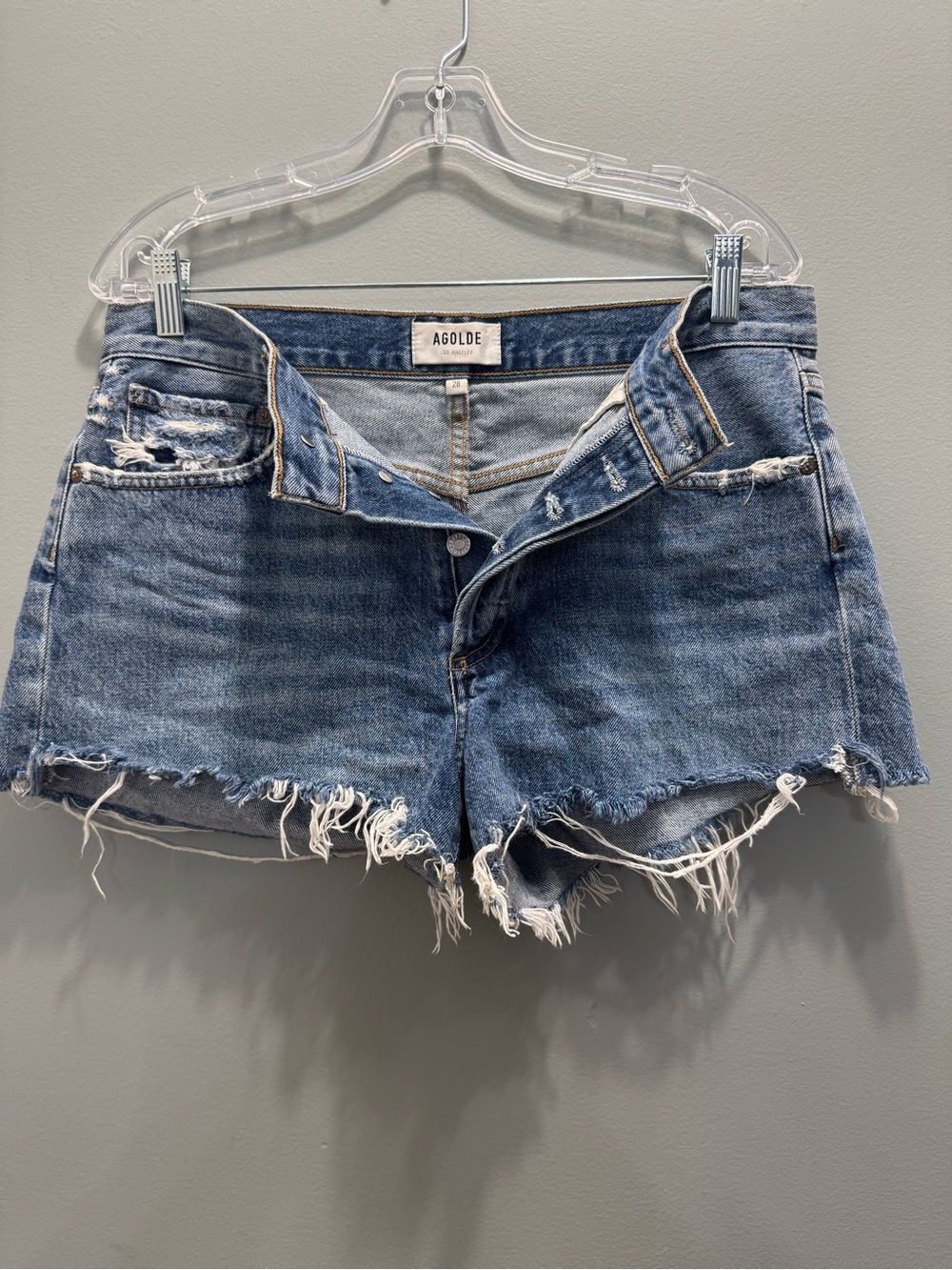 Agolde Distressed Light Blue Denim Cutoff Shorts
